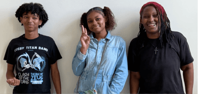 Three young people standing together